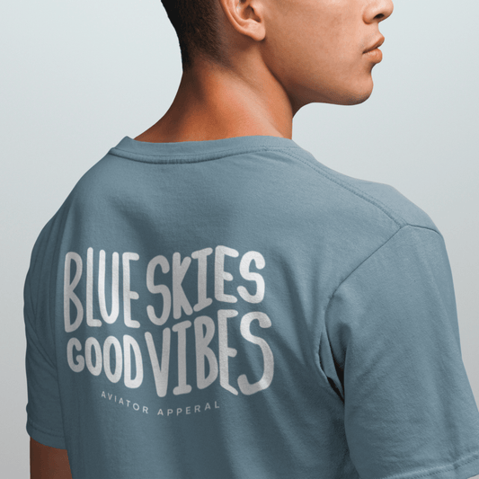 a male model wearing a stone blue Blue Skies, Good Vibes Aviator T-Shirt - Aviator Apparel